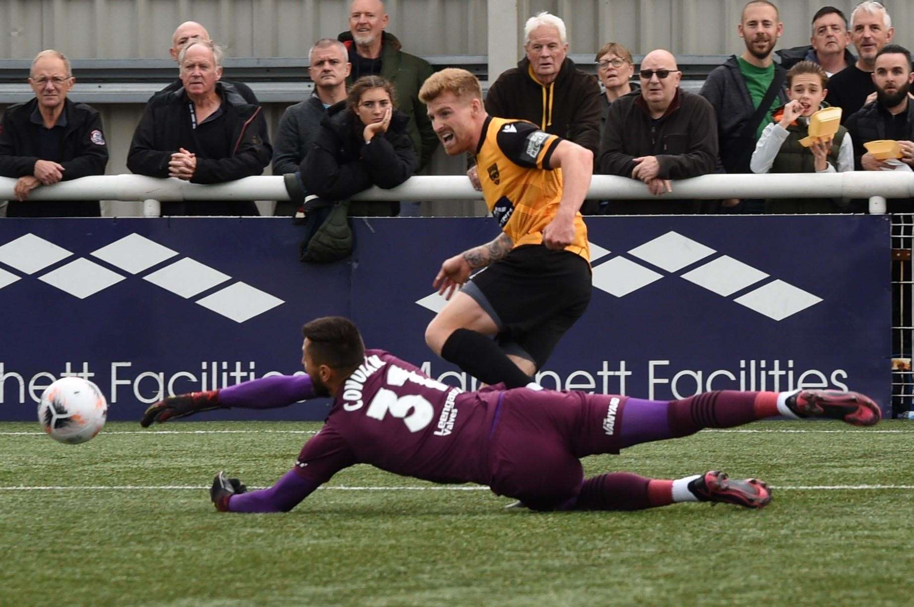 Jack Barham is denied by keeper Lucas Covolan during Maidstone's National League match against Chesterfield. Picture: Steve Terrell