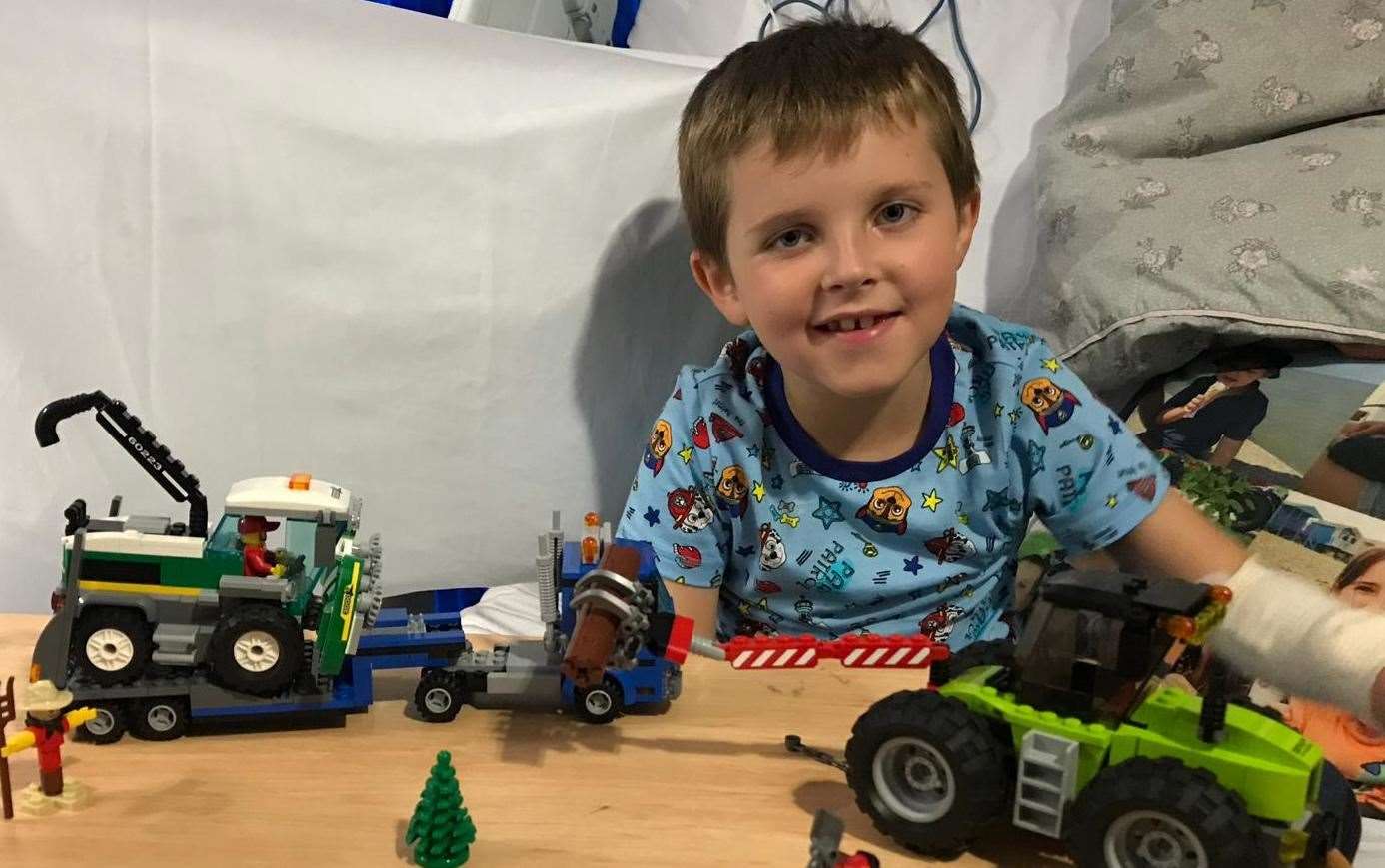 Joe Ward-Bates in King's College Hospital with the Lego sets he proudly built
