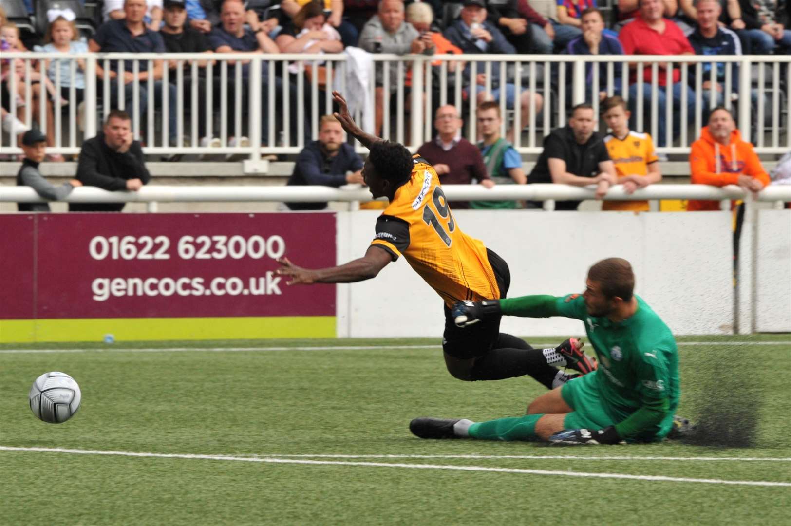 Jermaine McGlashan is taken down by Billericay keeper Bailey Vose on his Maidstone debut Picture: Steve Terrell