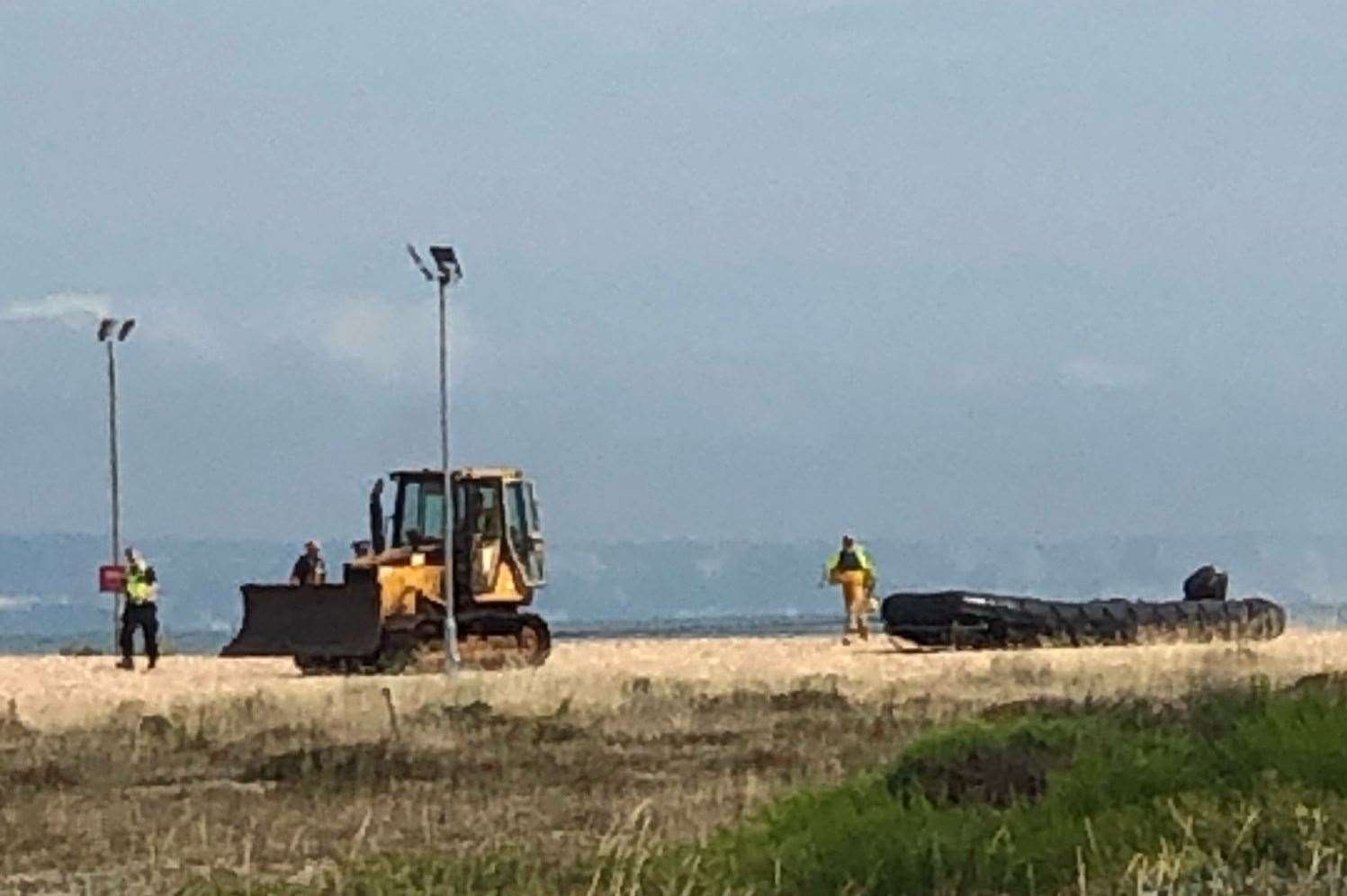A dinghy being dragged across the shingle at Dungeness this morning. Picture: Kylie Terry