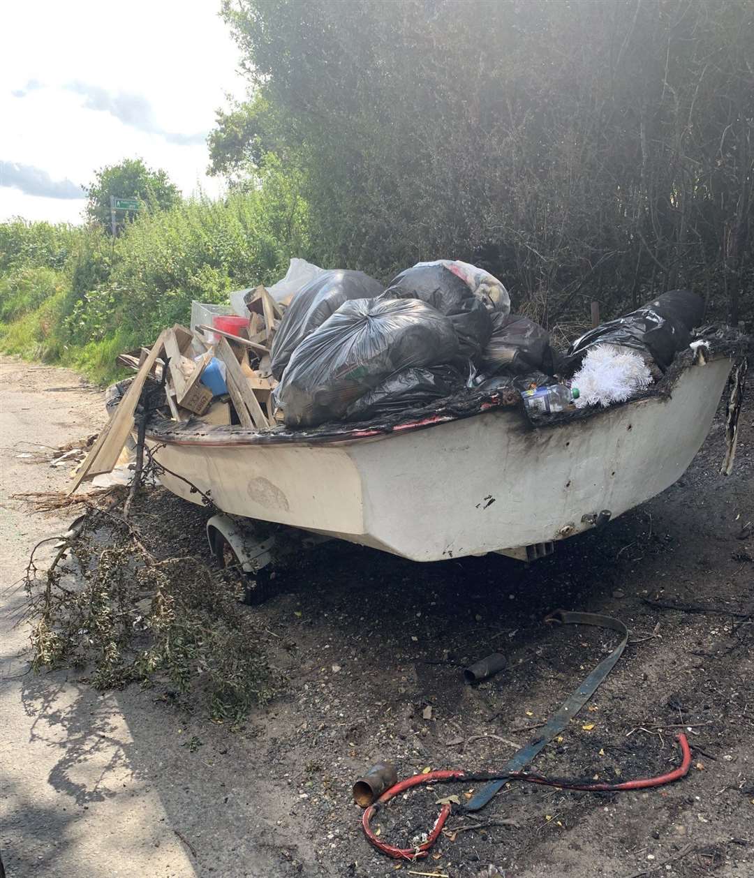 Glenda Crumpton is calling on Medway Council to move this boat full of rubbish dumped in Shawstead Road, Chatham. Image: Glenda Crumpton