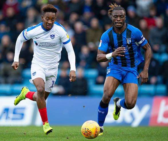 Gillingham captain Gabriel Zakuani competes with Portsmouth's Jamal Lowe Picture: Ady Kerry (6206640)
