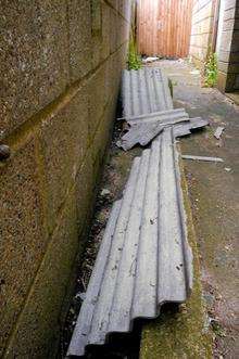 Children living in Beresford Road, Gillingham, found this corragated roofing containing asbestos in an alley behind their homes.