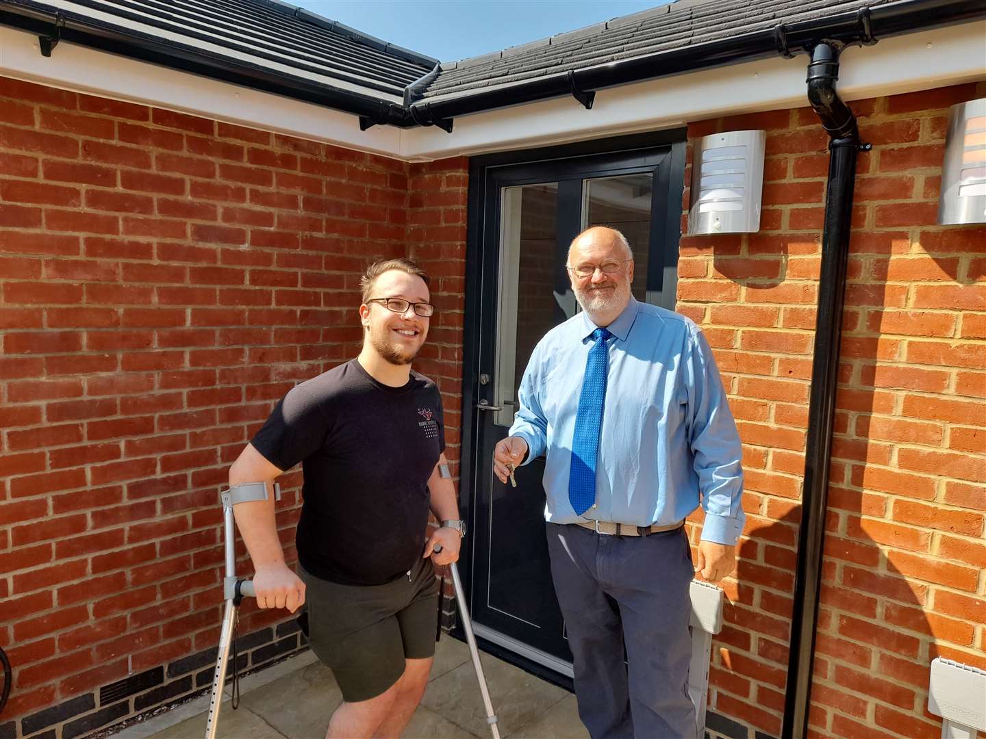New tenant Connor Palmer with council leader Jeremy Kite at Dartford council's new adapted homes for people with additional needs in Mead Crescent, Dartford. Picture: Dartford council