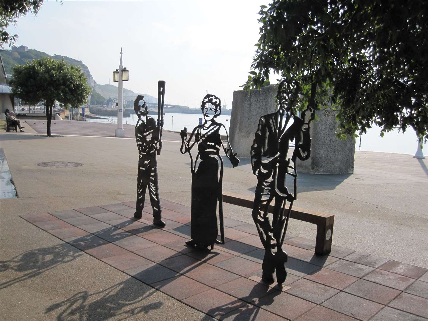 The three figures with the Sustrans Portrait bench, Jamie Clark, Dame Vera Lynn and Ian Fleming. Picture Dover District Council