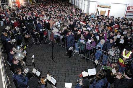 Rose Lane packed with people during the annual Carol Singing Concert in aid of the Lord Mayor's Christmas Gift Fund in Canterbury on Christmas Eve. Picture: Chris Davey.