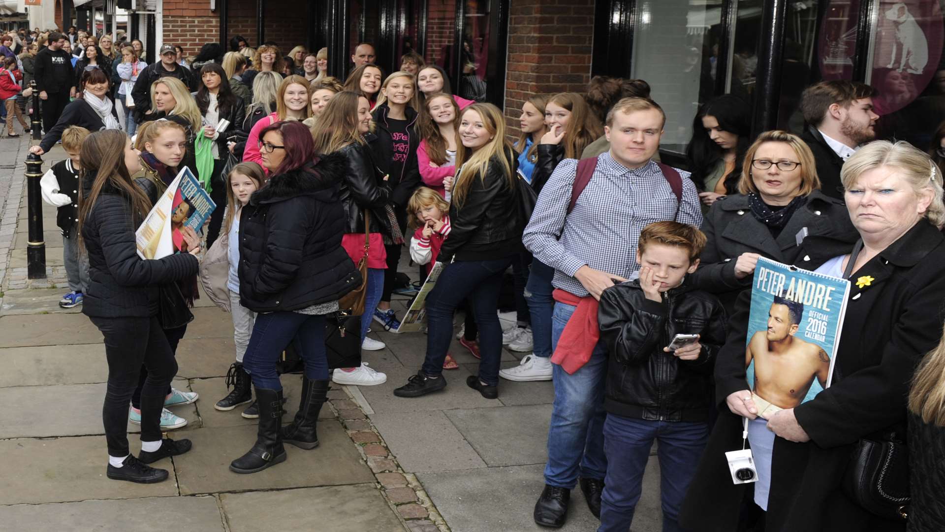 The queue builds outside HMV Canterbury for the arrival of Peter Andre