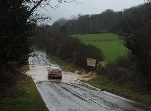 Flooding in the Alkham Valley Road by Sladden Farm. Picture: John Sheridan