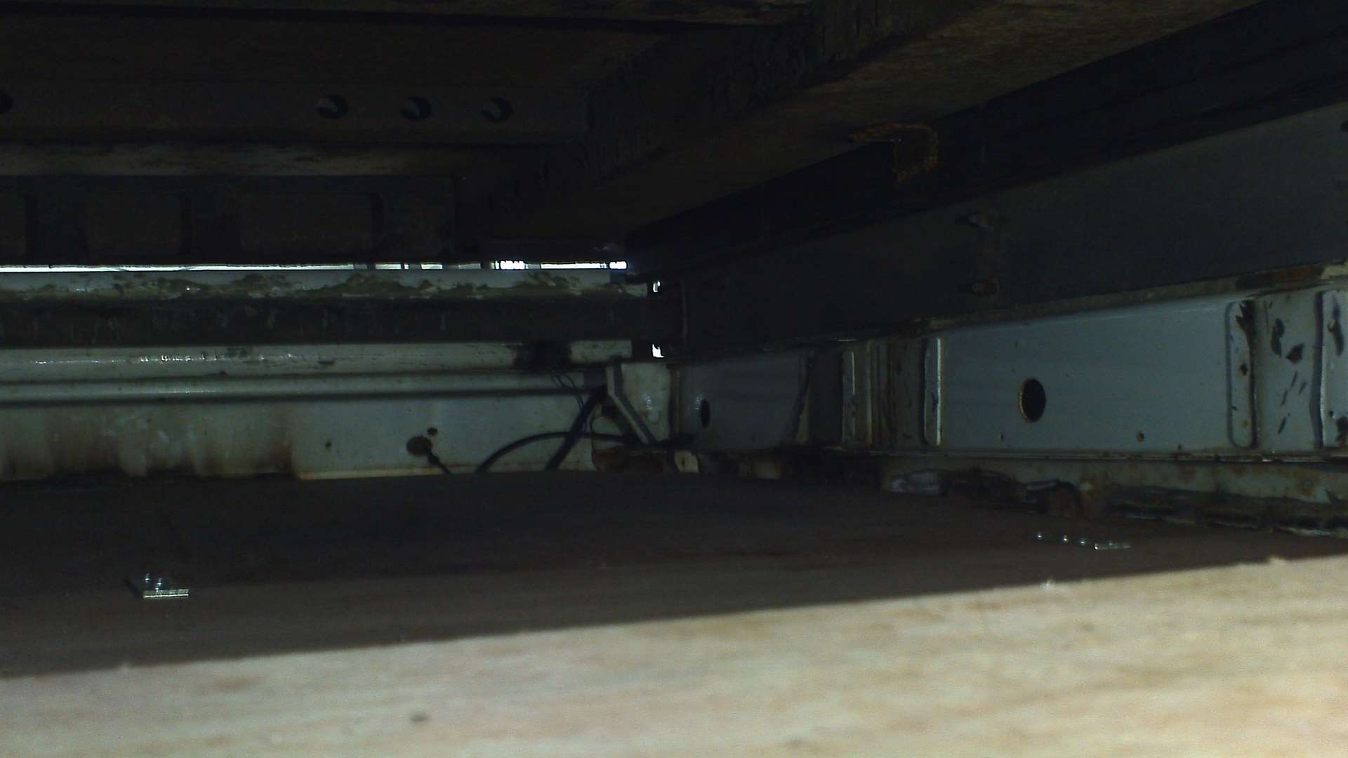The concealed area used to hide the migrants under the flatbed lorry