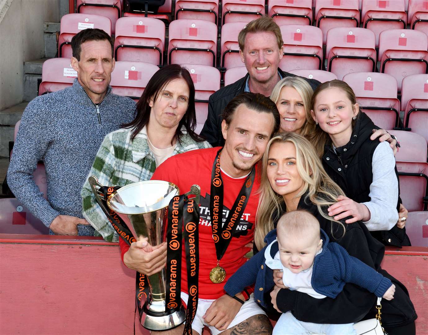 Ben Chapman celebrates Ebbsfleet's National League South title success in April 2023 with his family, including father Dan, far left. Picture: Simon Hildrew