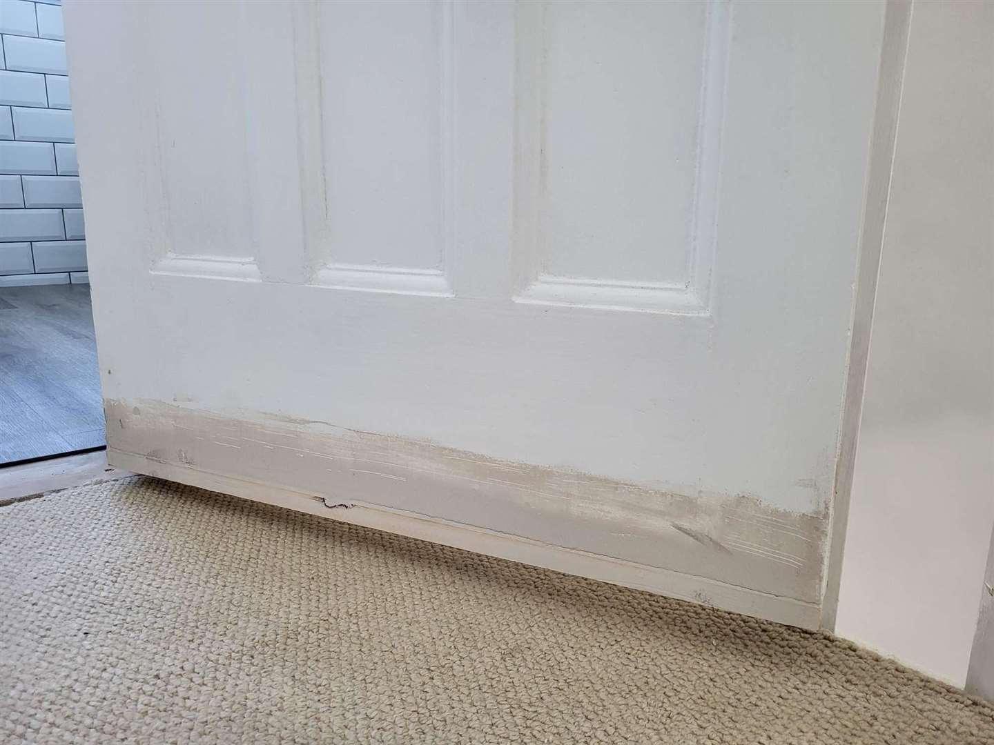 The door frame was too big for the door, so the fitter added a piece of wood