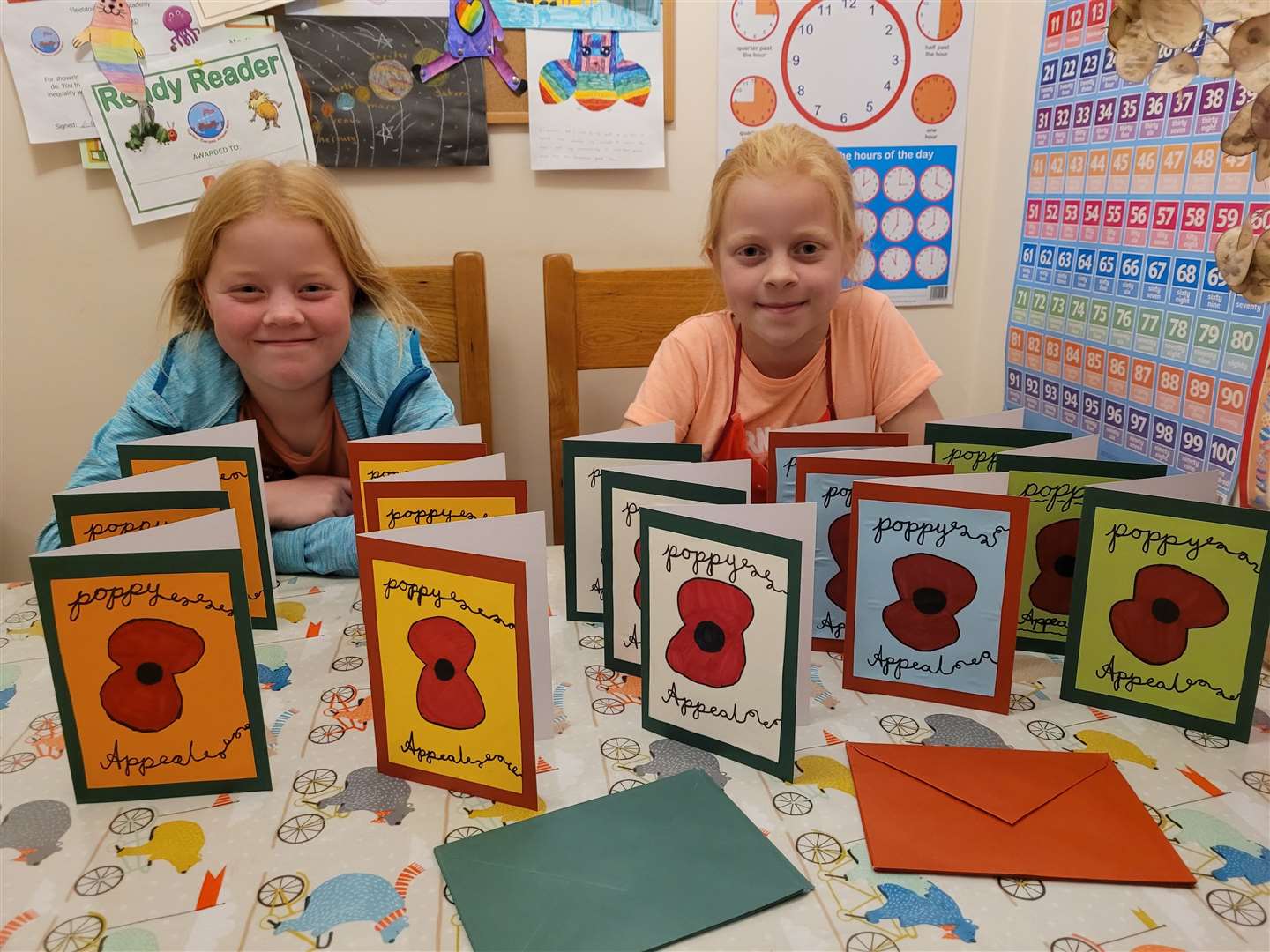 The sisters with their handmade cards for their Poppy Appeal