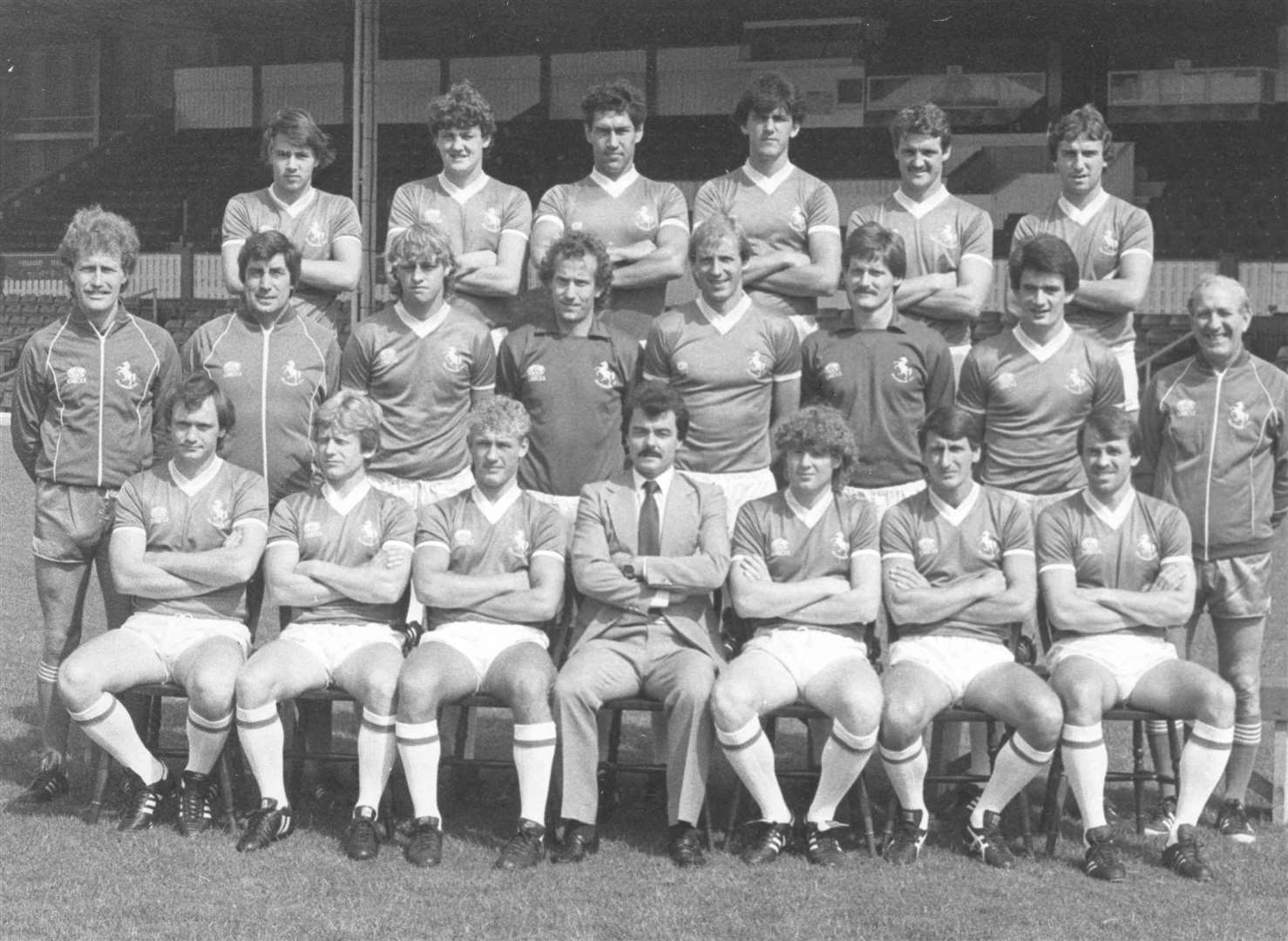 Dave Mehmet, pictured on the front row next to manager Keith Peacock in the 1983/84 season