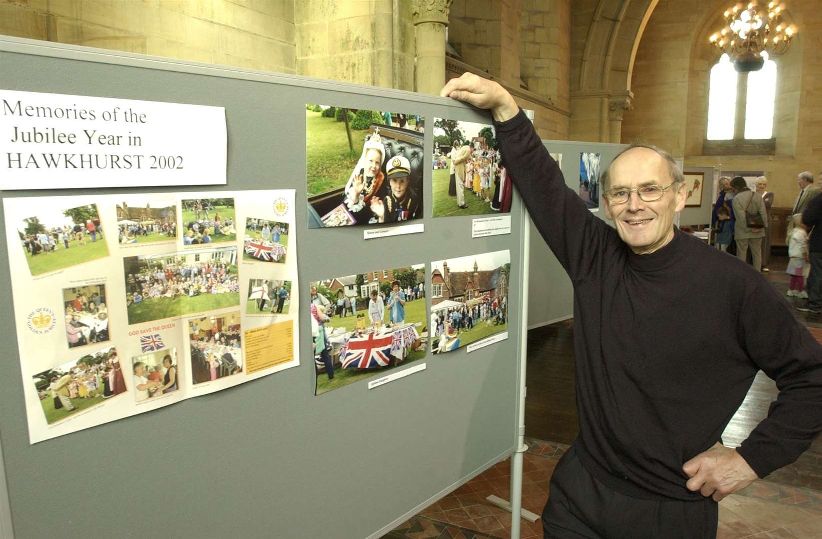 John Hunt with some of his photographs of Hawkhurst in an exhibition at All Saints Church to mark the Queen's Jubilee in 2002