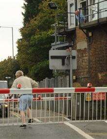 Man almost gets run over by train at level crossing.