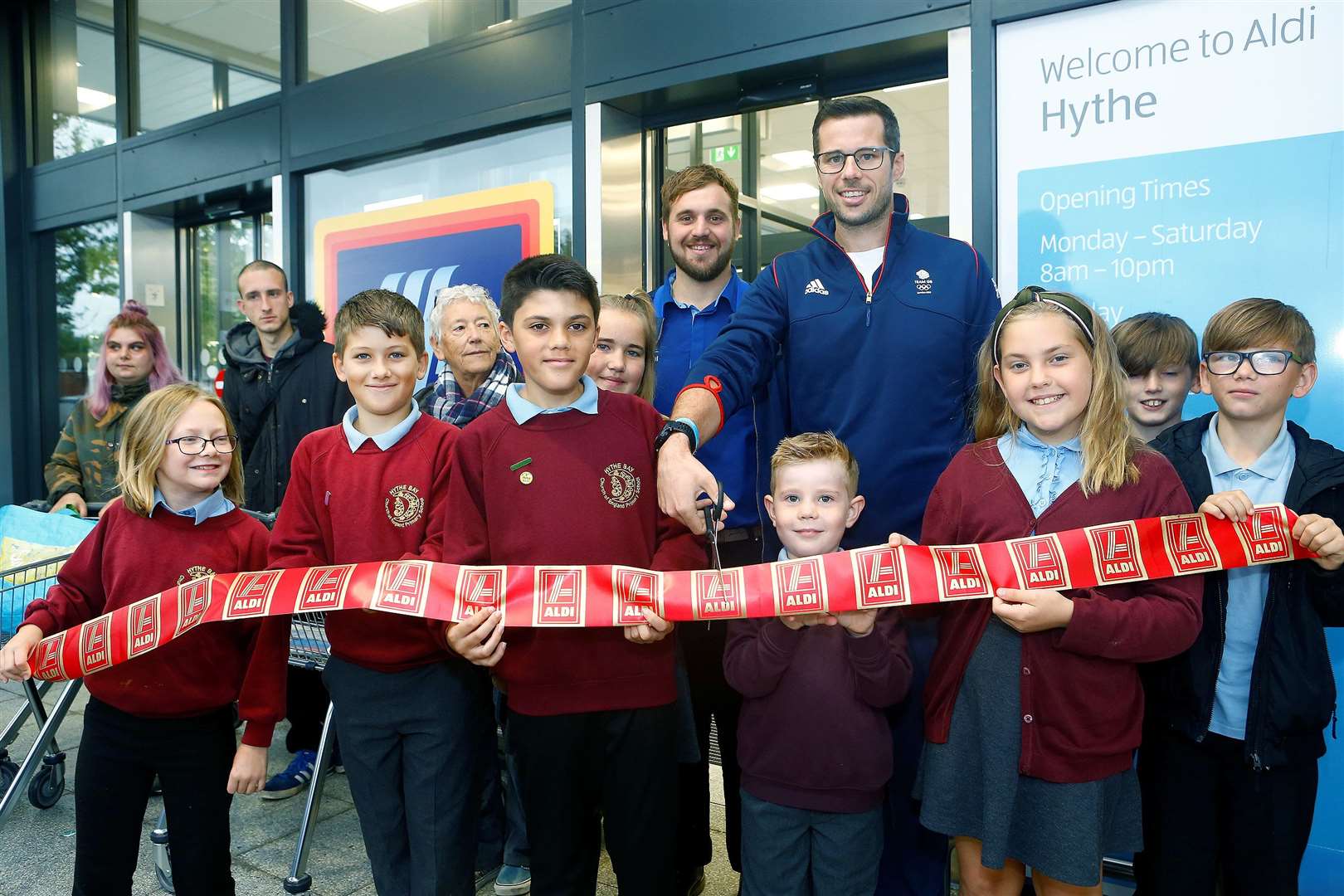 Olympic rower James Foad and children from Hythe Bay Primary opened the new store. Photo by Matt Bristow