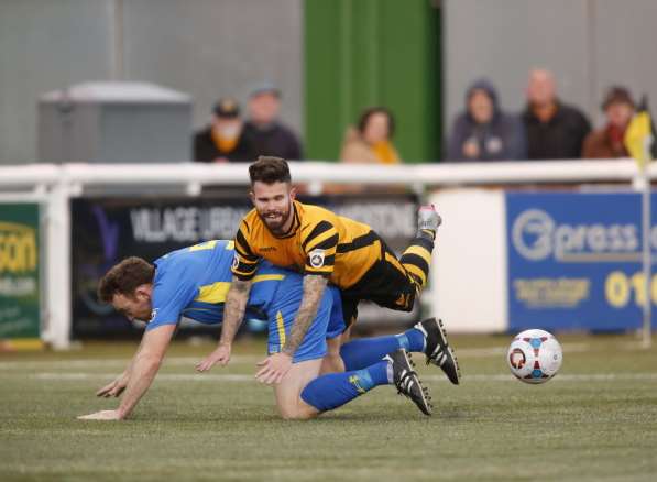 Adam Birchall is brought down for Maidstone's penalty Picture: Martin Apps