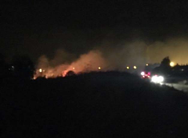 The glow of the field fire can be seen from Queensway and Brielle Way, Sheerness