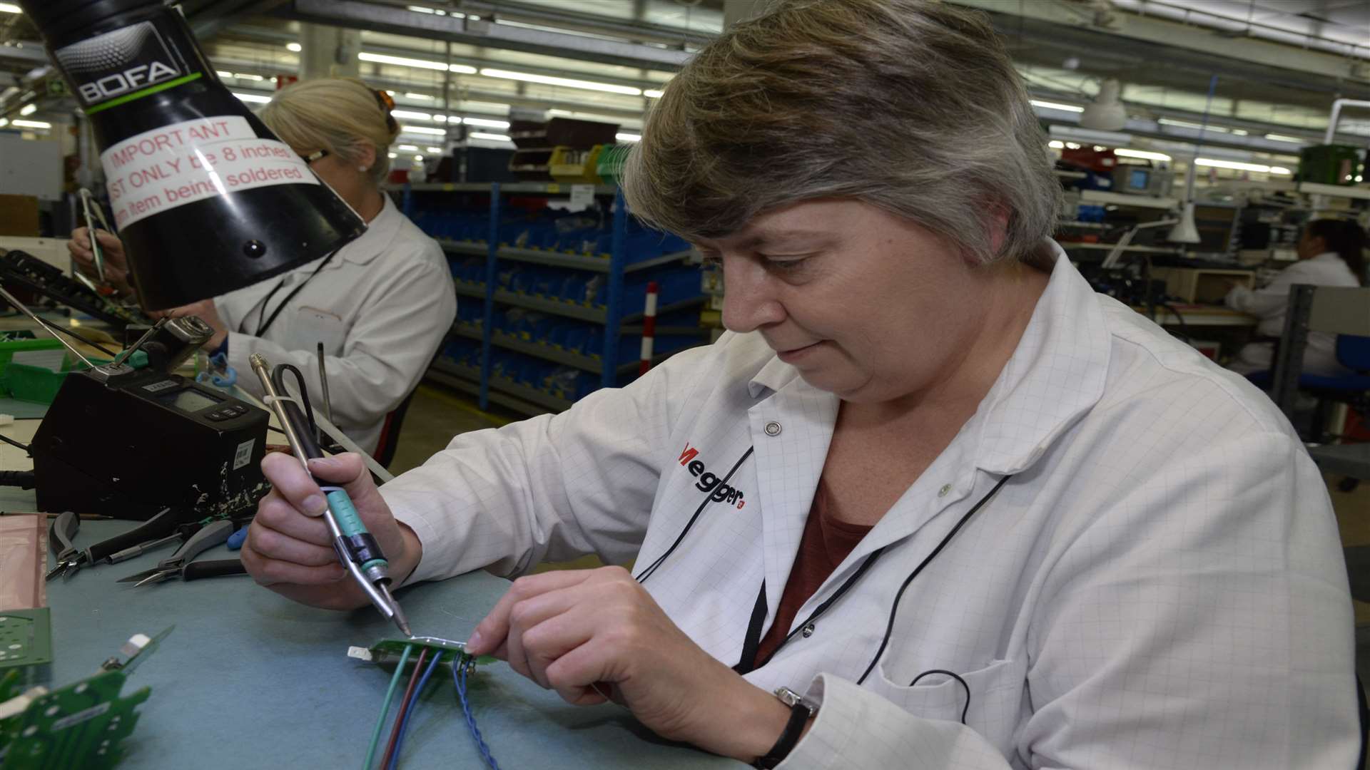 Ellen Wright at work on second stage assembly line at Megger