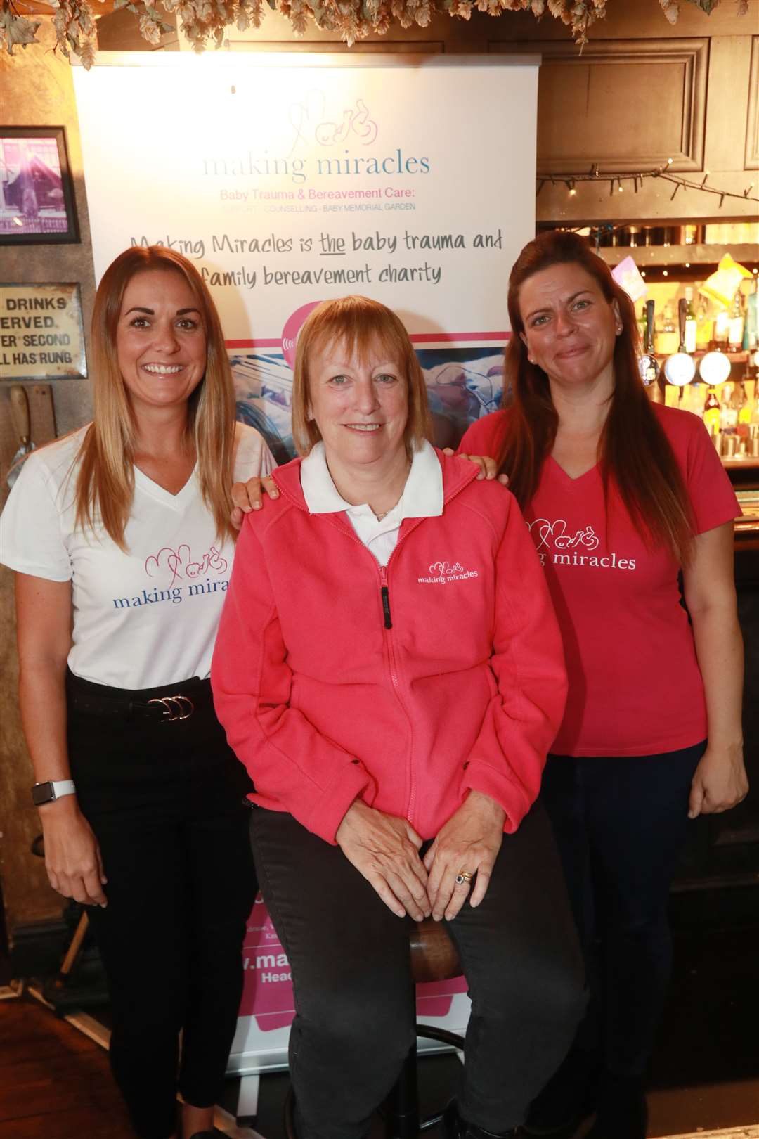 From left, Becci Johnson, area manager, Sally Howells, chairman and Kelly Wells, chief executive at a Making Miracles Coffee Morning held at The Oak on the Green in Bearsted. Picture: John Westhrop.