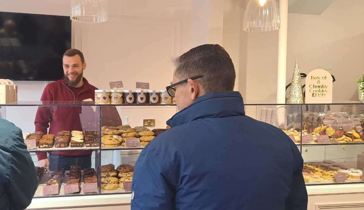 Scott being served by Rob at Cheran's Bakery in Canterbury. Picture: Megan Carr