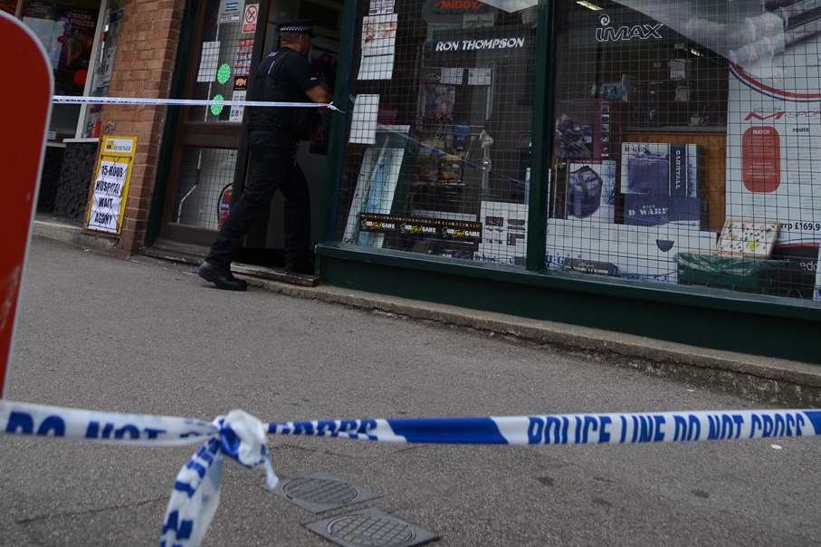A police cordon outside the shop in Rainham