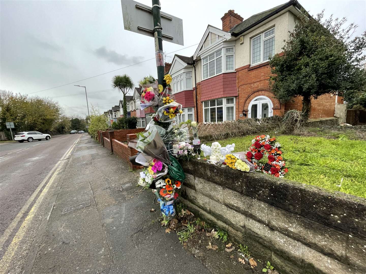 Floral tributes have been left in Station Road, Strood, for father-of-three Andy Millward. Picture: Sean McPolin