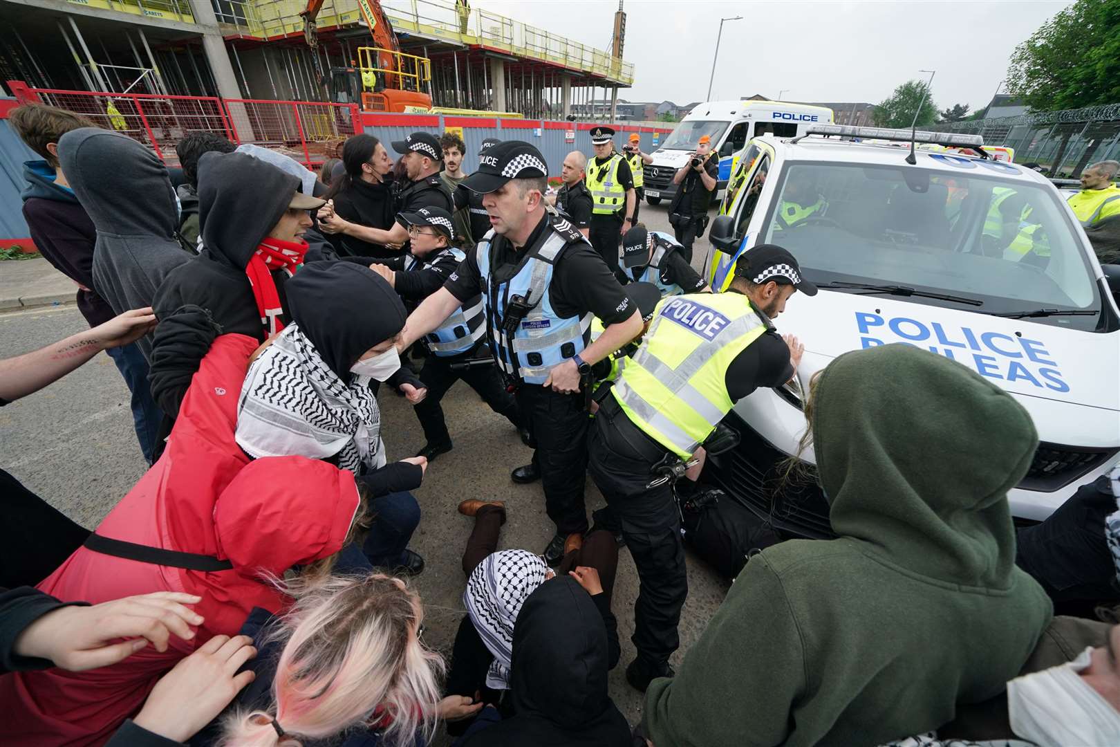 There were scuffles between the campaigners and police outside the factory (Andrew Milligan/PA)