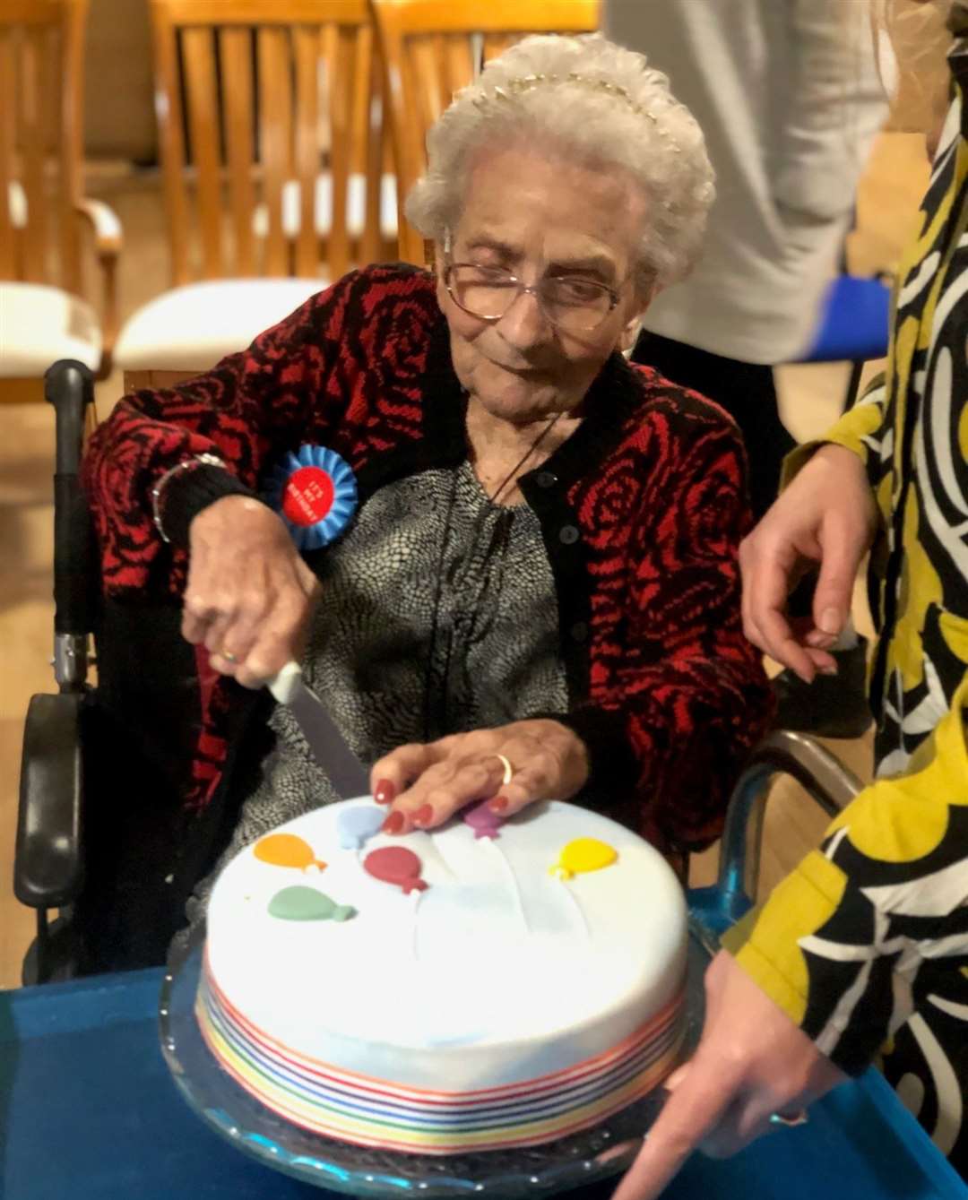 Vera cutting her cake during her birthday celebrations