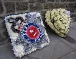 Floral tributes to PC Tring outside the church