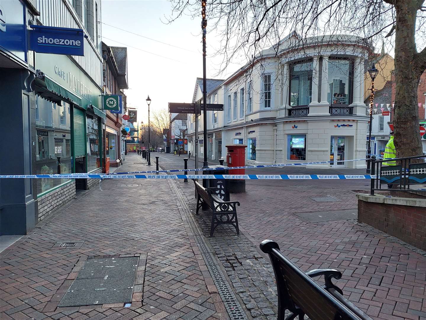 Ashford high street was taped off by police following the ‘unexplained’ death of a woman