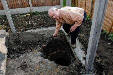 Raymond Wright, from Barming, with the well he discovered in his back garden