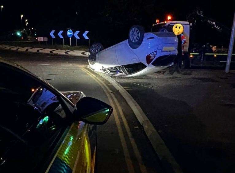 Police have seized a car after it flipped onto its roof at the Medway City Estate in Rochester. Picture: Kent Police