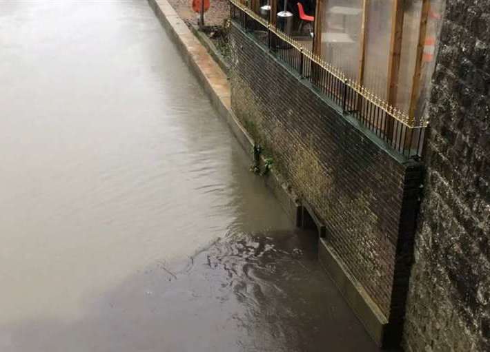 Unidentified black pollution spilling into the River Medway in Maidstone town centre in December last year