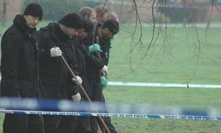 Police officers searching for clues. Picture: DAVE DOWNEY