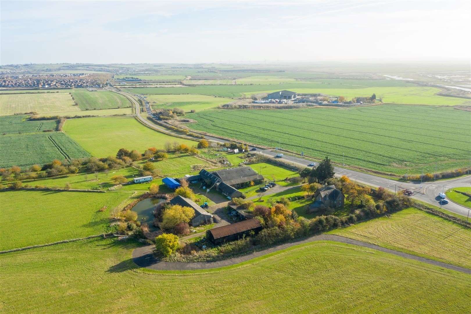 Aerial shot of Cowstead Farm at Minster, Sheppey, which is for sale through George Webb Finn for £2.5m. Planning permission for 700 homes has already been given for fields in the top left of the picture, which also shows the Lower Road. Picture: George Webb Finn