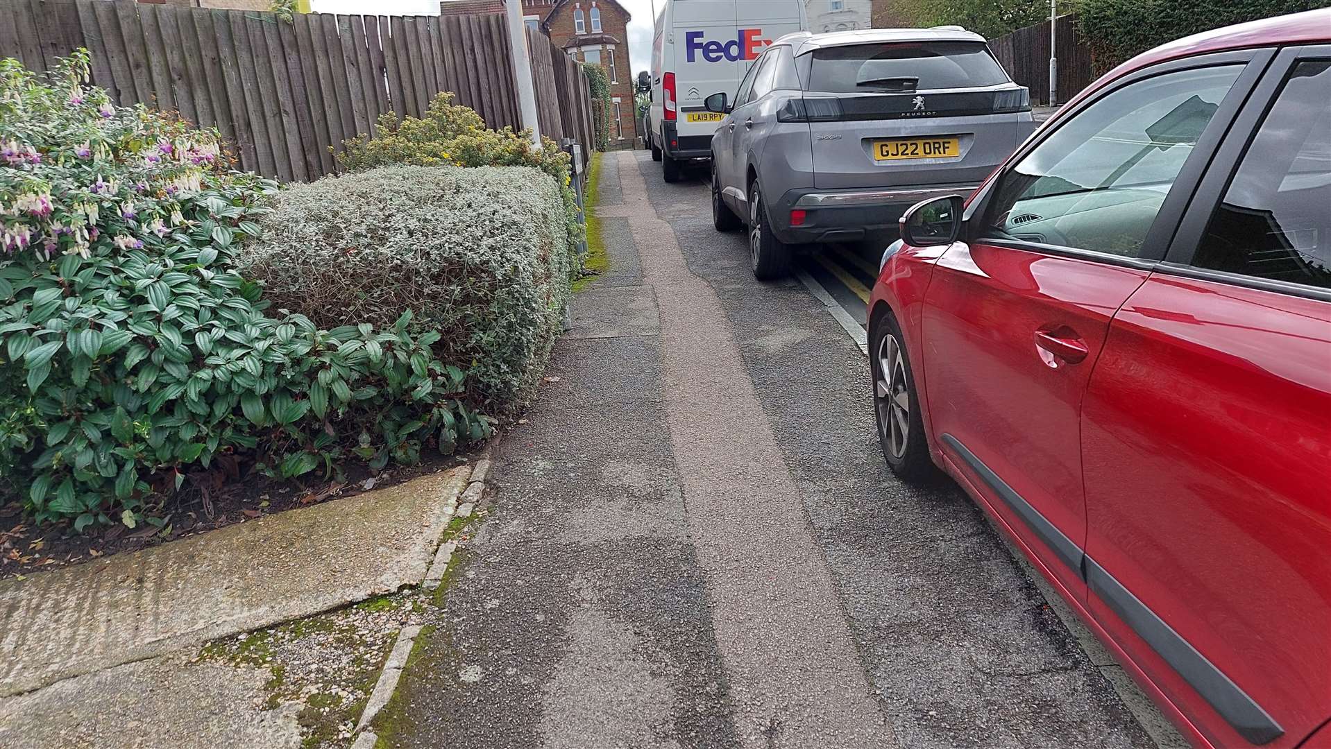 Cars parked on pavements in Foxglove Road in Ashford