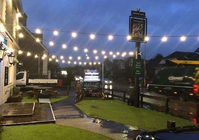 The Billet, on London Road in Sittingbourne, is well lit up at night and the area at the front is covered with artificial grass