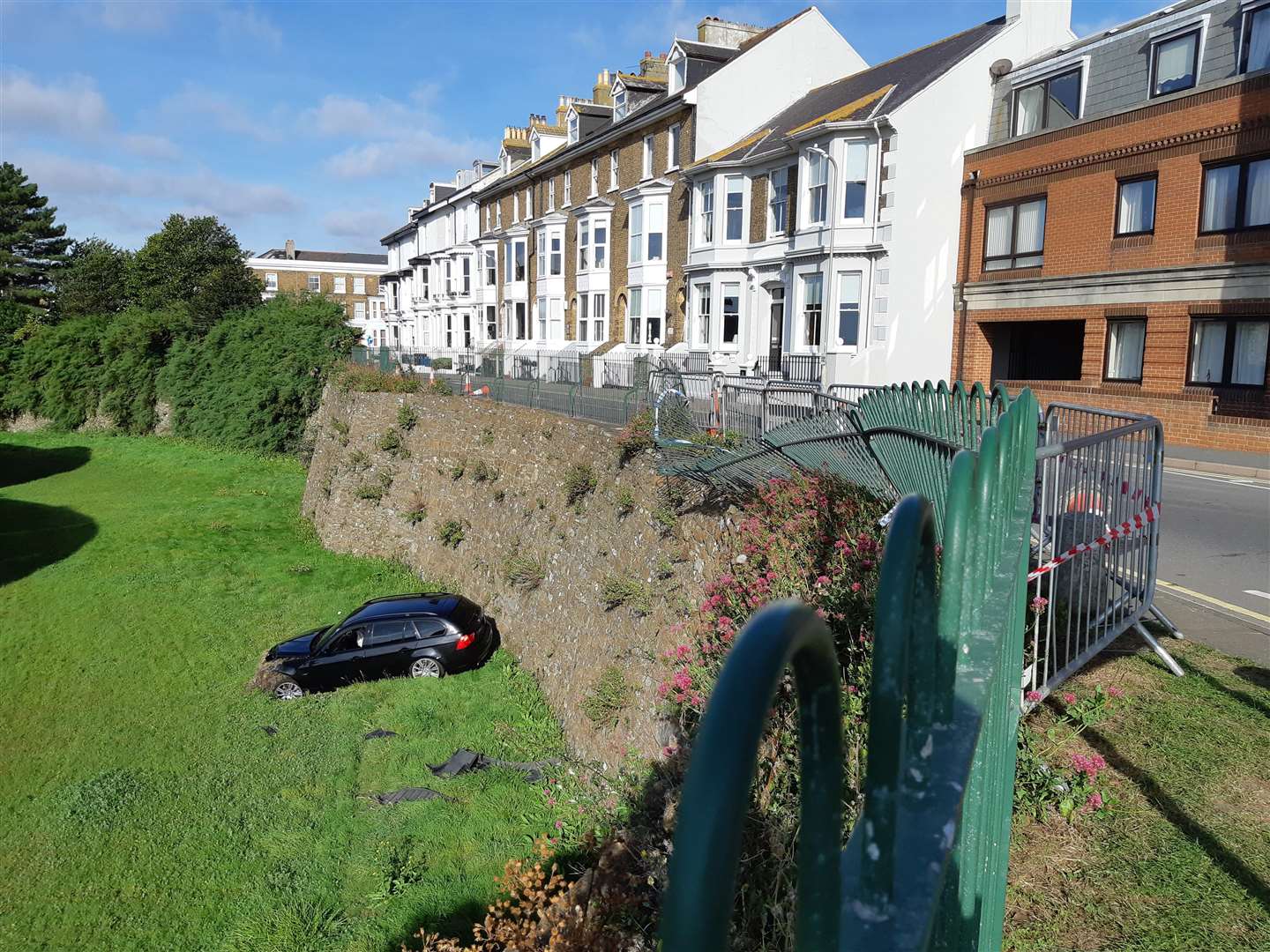 A black BMW plunged into the moat of Deal Castle after reportedly swerving to avoid pedestrians