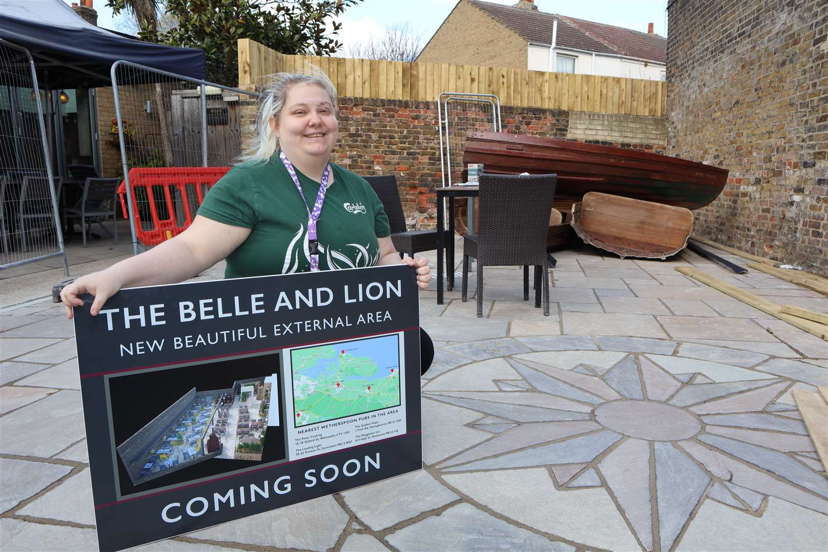 Team leader Michelle Cumber shows off plans for the garden extension at the Belle and Lion pub in Sheerness High Street