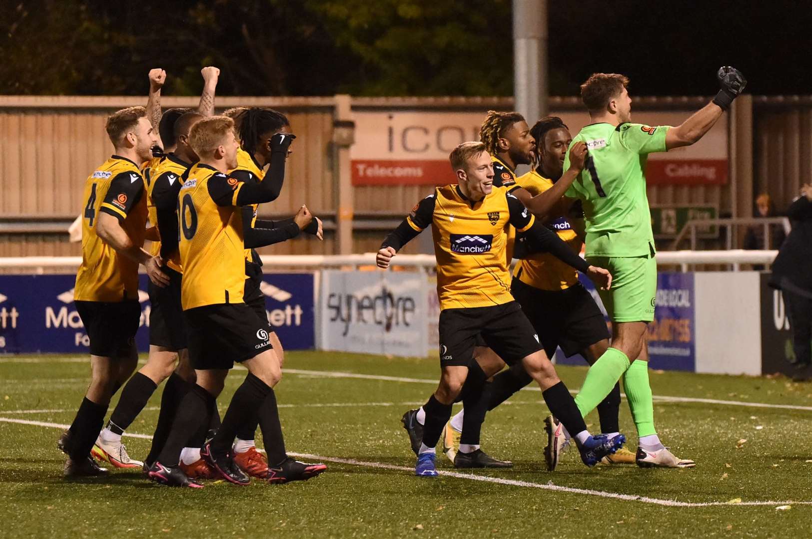 Tom Hadler and his Maidstone team-mates celebrate shoot-out success against Billericay Picture: Steve Terrell