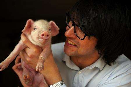 Chris Price makes a porcine friend
