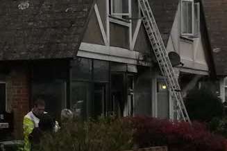 Crews used a ladder to access the roof