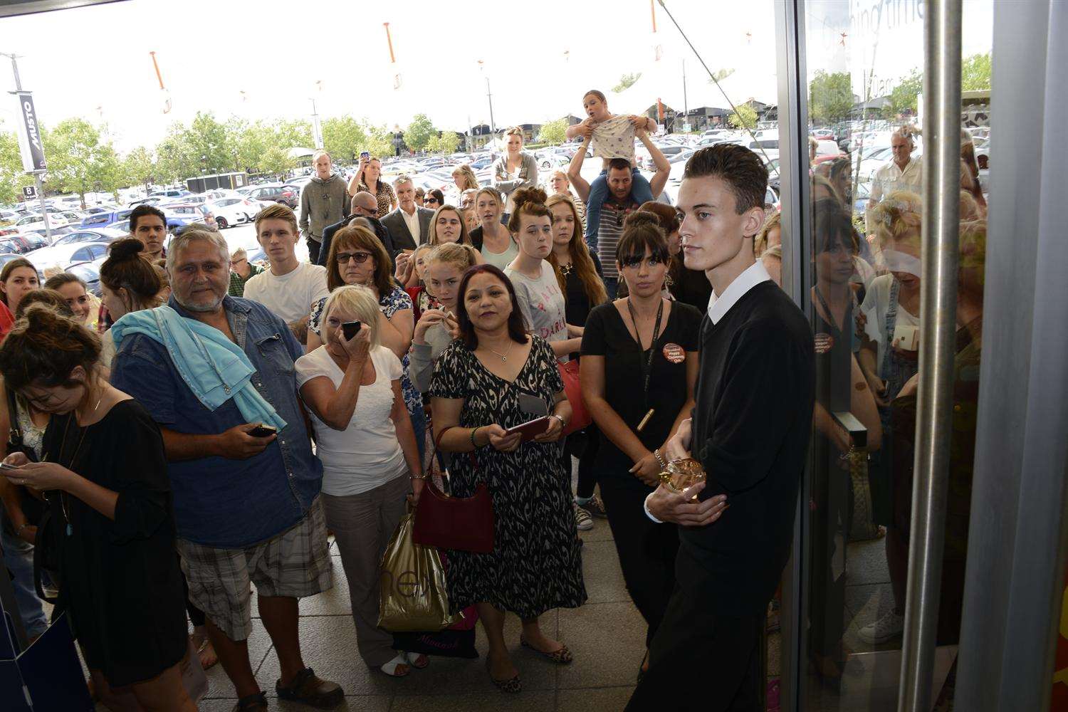 Crowds wait to see Samantha Faires outside The Fragrance Shop at Ashford Designer Outlet.