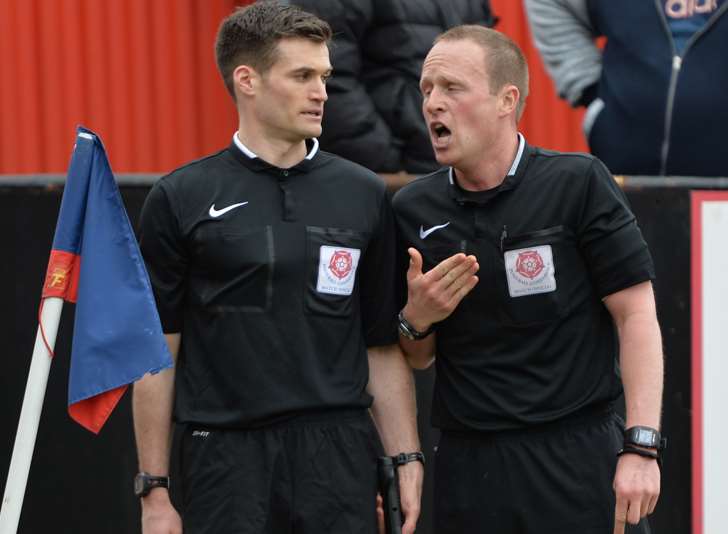 Referee David Rock (right) overrules his assistant Picture: Keith Gillard