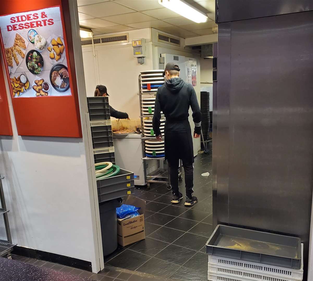 Staff at Pizza Hut in Perry Street caught preparing a pizza on top of a fridge