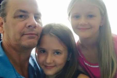 Paul Scanlan with his daughters Alex (left) and Kayla (right)