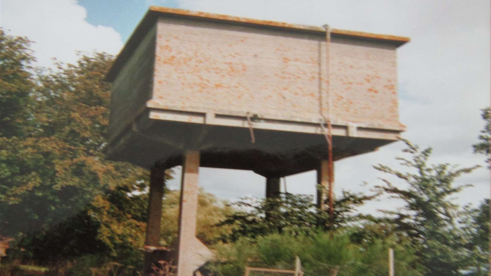 The concrete water tower before it was transformed