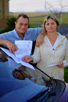 Michael and Linda Wilson with the paperwork relating to the parking ticket