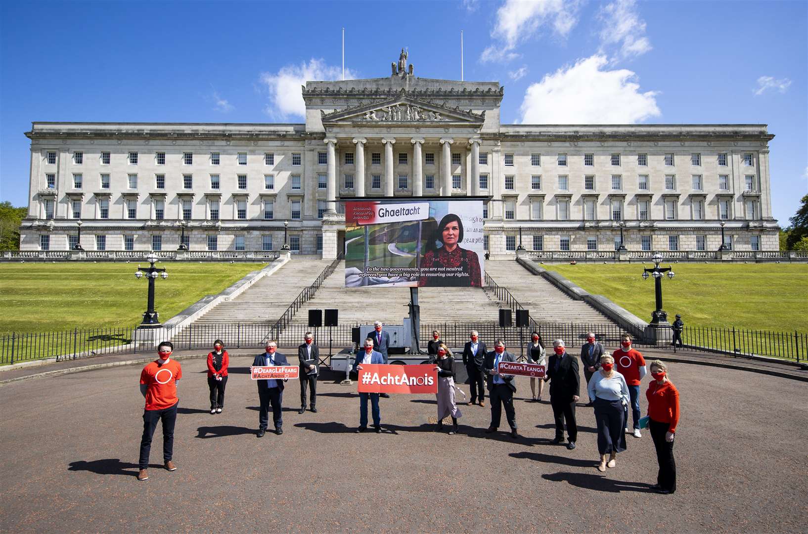 Sinn Fein MLAs with Irish language campaigners outside Parliament Buildings at Stormont (Liam McBurney/PA)